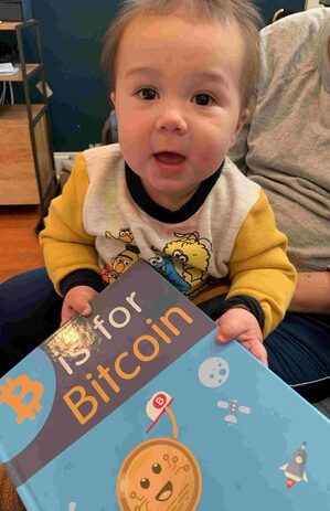 Kid with bitcoin book