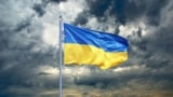 Ukraine flag in a dark sky