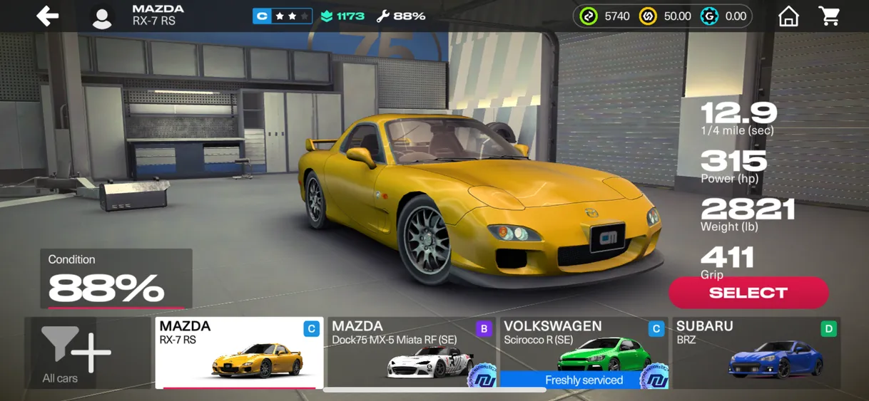 game screenshot showing yellow Mazda car in a garage. Game layout on lower UI panel shows three other cars in D, B, and C tier.